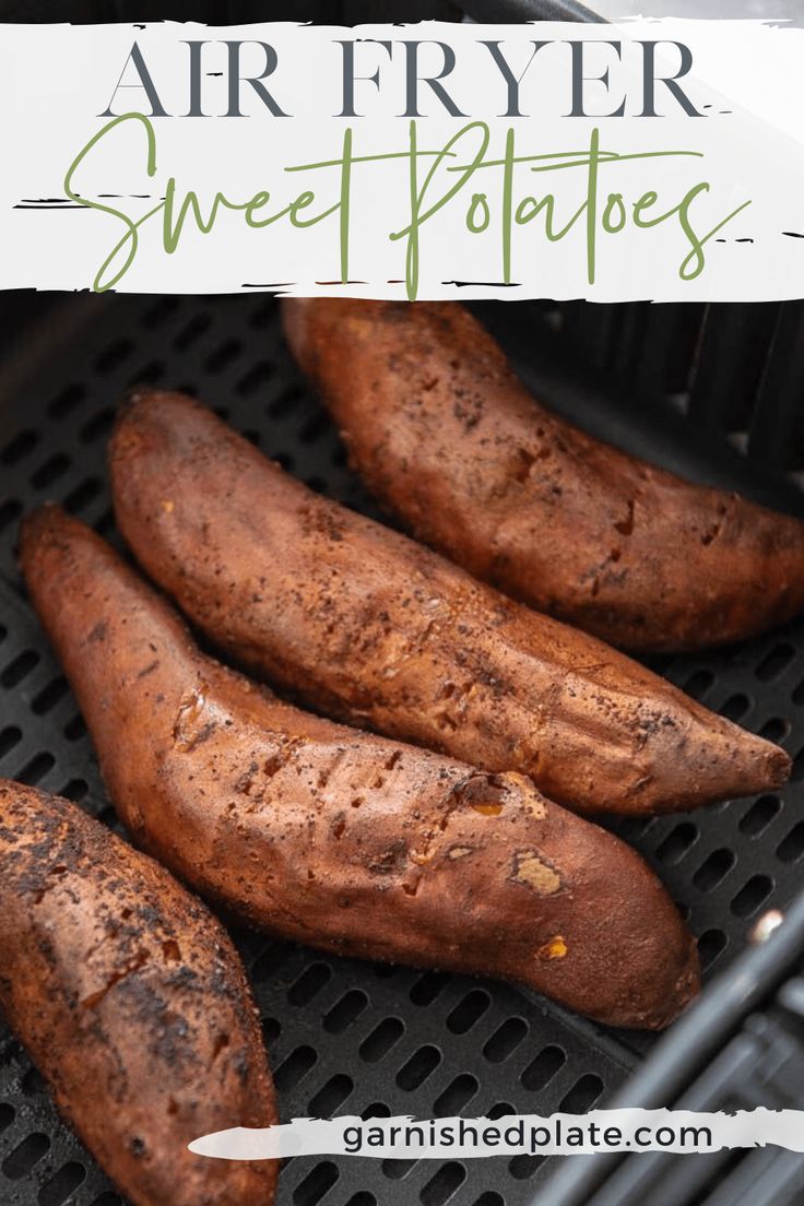 four sweet potatoes sitting on top of a grill with the words air fryer sweet potatoes