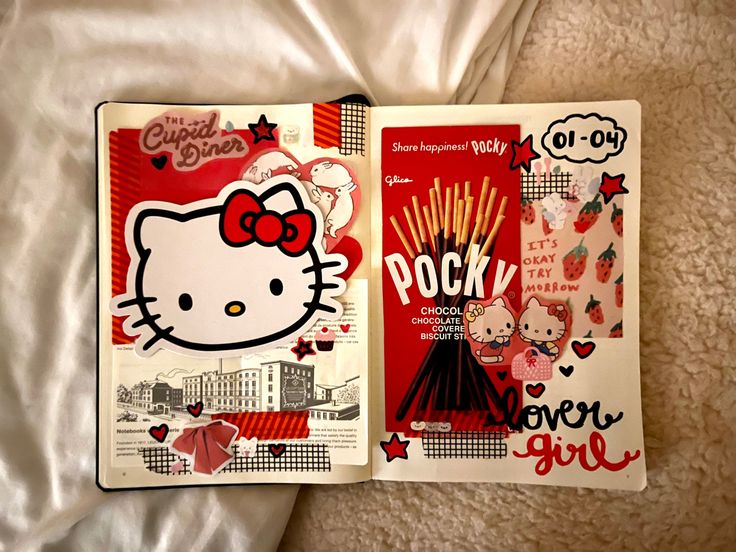 two hello kitty books laying on top of a bed