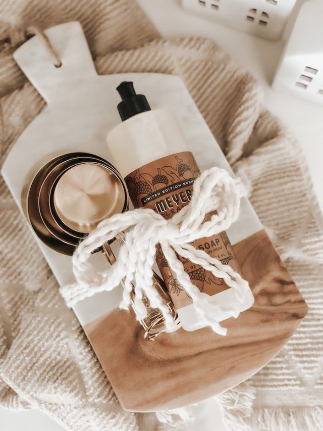 the contents of a travel bag laid out on top of a blanket, including toiletries