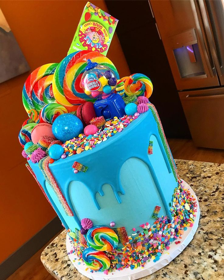 a colorful cake with lots of candy on top