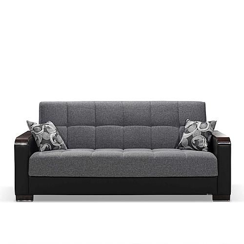 a gray and black couch sitting on top of a white floor