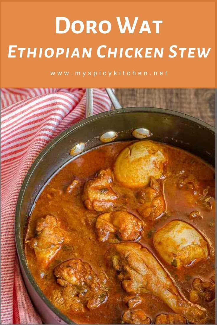 a pot filled with chicken stew on top of a red and white towel