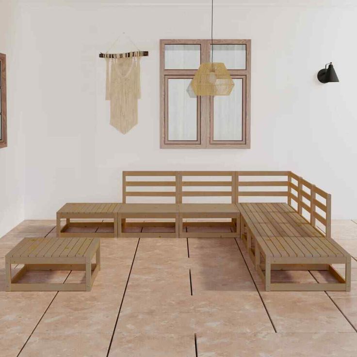 a wooden bench sitting on top of a tiled floor next to two pictures hanging on the wall