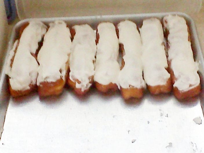 several donuts are lined up on a pan