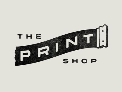 the print shop logo on a gray background with black and white lettering that reads, the print shop