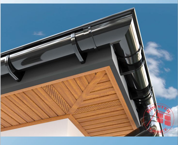 a close up view of the roof and side of a house with wooden shutters