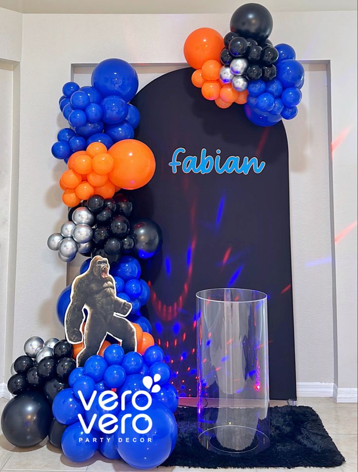 balloons and decorations are displayed in front of a sign