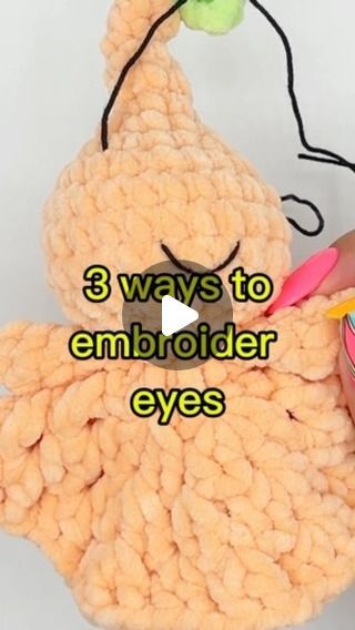 a person holding a stuffed animal with the words 3 ways to embroider eyes