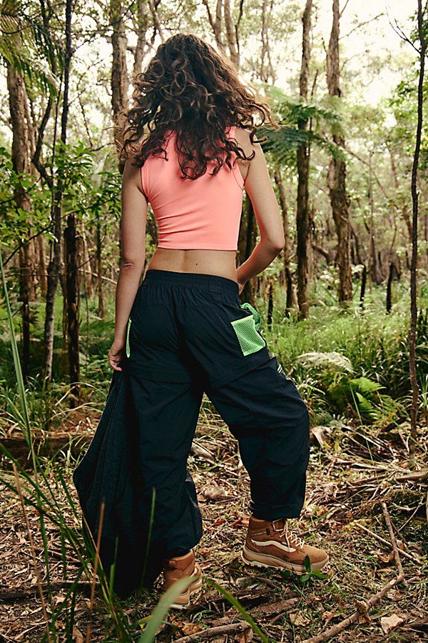 Made for your next hiking trip, these convertible pants feature a high-rise fit and cargo-inspired pockets with cinched bottom hems. **Fit:** High-rise, slouchy, relaxed fit, ankle-length **Features:** Durable, water-resistant fabrication; convertible design that zips off and turns into shorts, stretchy elastic waistband, zip-fly and button closure, belt loops at waistband, zippered pockets at legs, pockets with snap-button closures, contrast trim **Why We | Morning Meadow Hike Pants by FP Movem Summer Hiking Cargo Pants With Pockets, Summer Cargo Pants With Pockets For Hiking, Summer Wide Leg Cargo Pants For Outdoor Activities, Summer Hiking Cargo Pants With Cargo Pockets, Summer Hiking Pants With Cargo Pockets, Functional Cargo Pants For Summer Outdoor Activities, Functional Summer Cargo Pants For Hiking, Functional Summer Cargo Hiking Pants, Summer Parachute Pants With Side Pockets For Outdoor