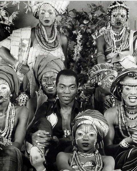 an old black and white photo of some people wearing headdresses on their heads