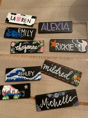 several different name tags on a piece of cloth with the names of people in them