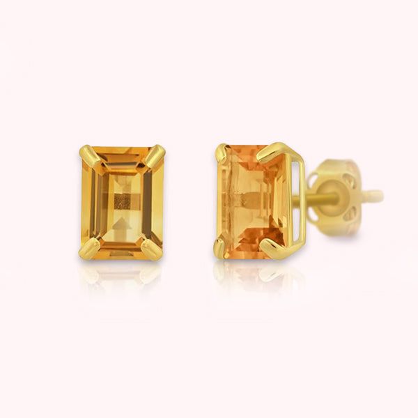 Introducing our "Baroness" Emerald Cut Citrine Solid 14k Gold Stud Earrings – a captivating blend of luxury and radiance. These exquisite earrings embody timeless design, expert craftsmanship, and the captivating allure of natural Citrine set in solid gold. The emerald cut, celebrated for its sophistication, gives these earrings a timeless and distinct appeal. They gracefully transition from everyday sophistication to special occasions, adding a touch of regal beauty to your attire. Embrace the Luxury Yellow Gold Citrine Earrings, Luxury Citrine Jewelry With Matching Earrings, Luxury Yellow Gold Topaz Earrings, Classic Citrine Jewelry With Gemstone Accents, Elegant Citrine Jewelry With Prong Setting, Elegant 14k Gold Orange Jewelry, Formal Yellow Gold Topaz Earrings, Timeless Yellow Gold Topaz Jewelry, Elegant Formal Citrine Earrings