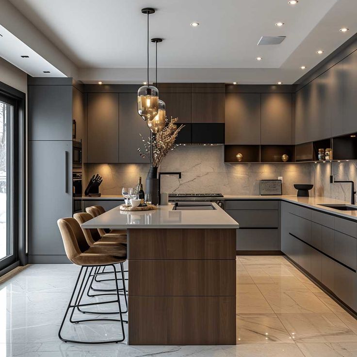 a modern kitchen with marble counter tops and stainless steel appliances