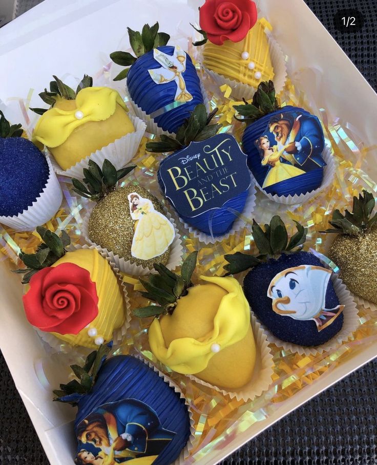 there are many cupcakes that have been decorated to look like beauty and the beast