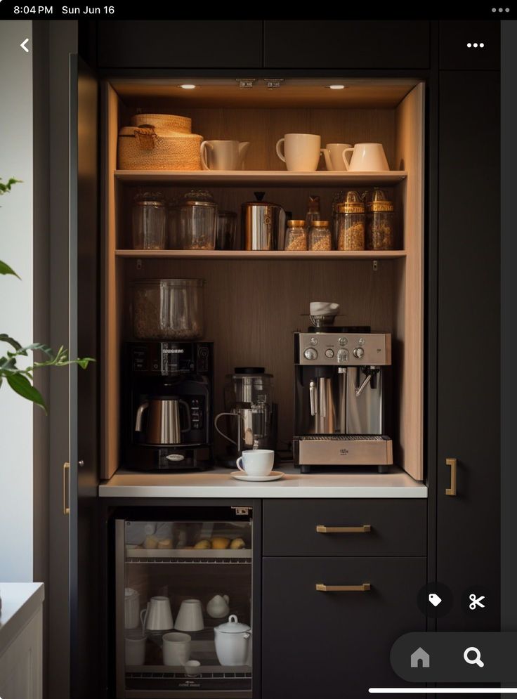 an open cabinet with coffee maker and cups