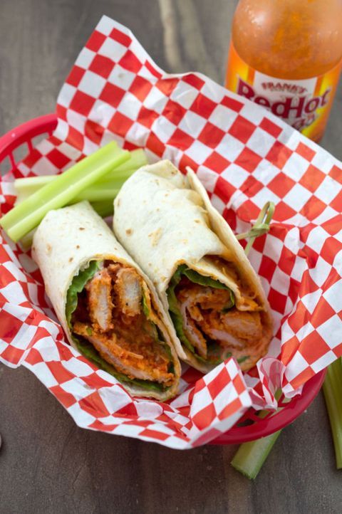 an easy buffalo chicken wraps recipe in a basket with celery