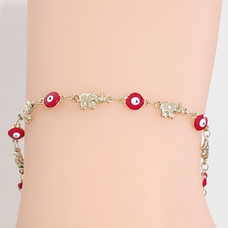 14k Gold Plated Elephant Red Eye Bracelet Pulsera De Elefante Y Ojitos Rojo Baado En Oro 14k Size : 8" Lenght/ Ancho Aprox New. Elegant Red Bracelets For Good Luck, Gift Red 14k Gold Bracelet, Red Gold Plated Bracelet, Red 14k Gold Dainty Bracelet, Red Bangle Gold Bracelet As Gift, Elegant Red Handmade Charm Bracelet, Elegant Handmade Red Charm Bracelet, Blossom Bracelet, Heart Bangle Bracelet