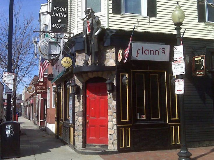 a street scene with focus on the storefronts and sign for clon's