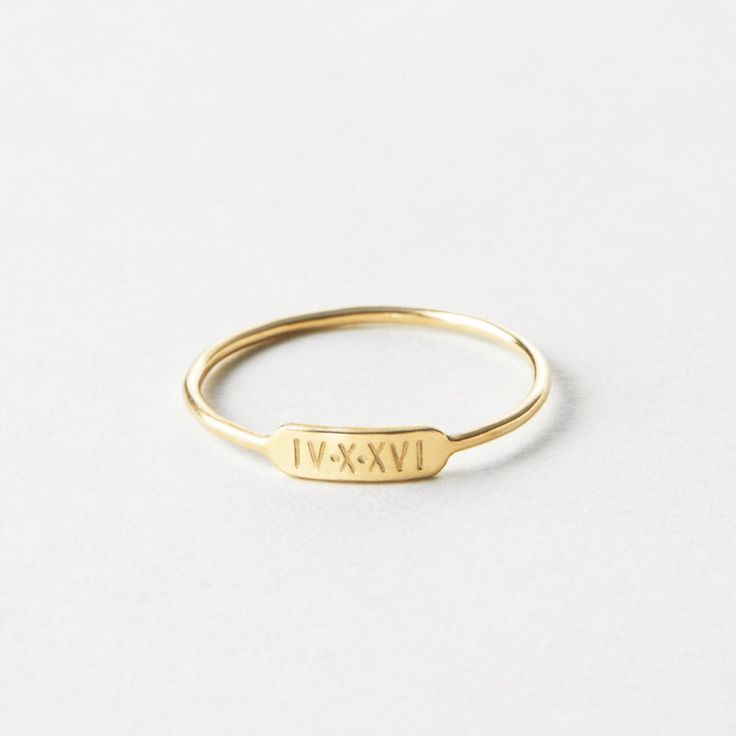 "A minimal, dainty ring that says so much! Personalize your bar ring with initials, names, dates or symbols or leave it blank. Made to last using high-quality materials and authentic hand-stamped personalization so you'll cherish it for years to come.  Every piece is handcrafted and hand-personalized with love in La Conner, WA, using 90% recycled and 100% ethically sourced raw materials from the USA--because it's better that way. Includes free gift-ready packaging (featuring a care card and traditional letterpress goodies made by my dad)!  MATERIALS: * Gold = 14k gold filled * Silver = sterling silver * Rose gold = 14k rose gold filled DETAILS: * 9x2.8mm bar * Hand-personalized with traditional metal punches AT CHECKOUT: * If you chose \"other\" for size, specify which ring size you'd like Date Engraved Ring, Ring Stamping Ideas, Minimalist Stackable Initial Ring For Anniversary, Simple 14k Gold Engraved Ring For Anniversary, Classic Personalized 14k Gold Midi Rings, Minimalist Stackable Rings With Initials For Anniversary, Minimalist Personalized Yellow Gold Midi Rings, Personalized Minimalist Yellow Gold Midi Rings, Minimalist Initial Ring With Engraving Option