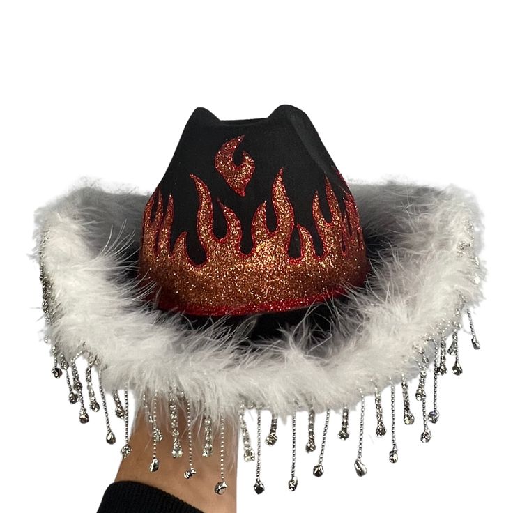 Our Cowgirl Hats are a stylish addition to your rave wardrobe, and come in Pink & White Flames, Black and Red Flames, Black Gems, and White Gems to match any outfit! Flame Cowboy Hat, Punk Winter Hat For Festivals, Punk Style Winter Hats For Festival, Wide Brim Winter Party Hat, Winter Festival Punk Style Hat, Western Black Costume Hats And Headpieces For Party, Winter Party Fedora Costume Hat, Punk Brimmed Winter Hats, Punk Style Brimmed Winter Hat