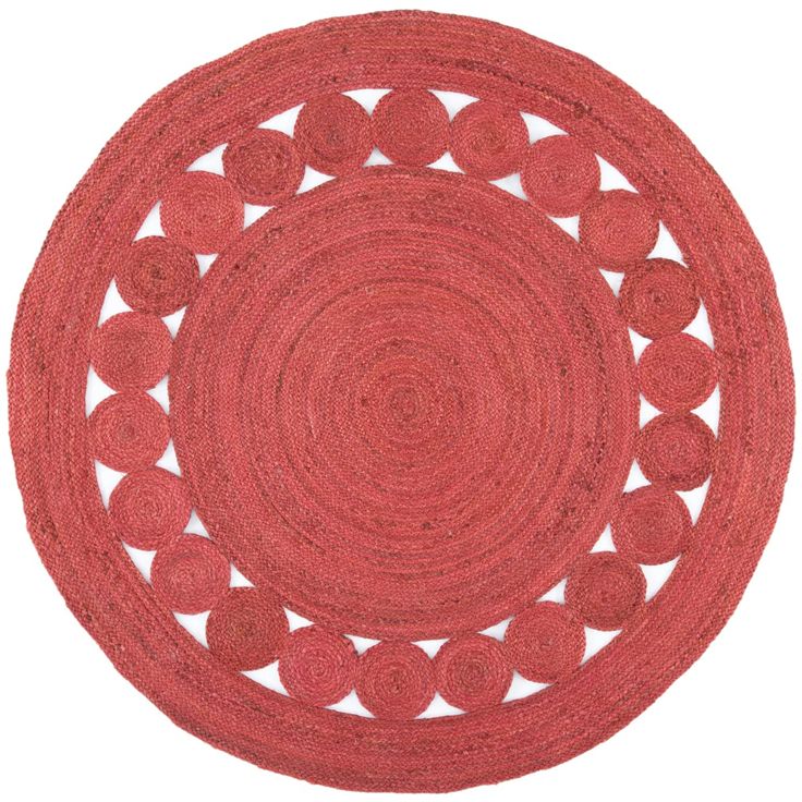 a red rug with circles in the middle on a white background, it looks like an oval