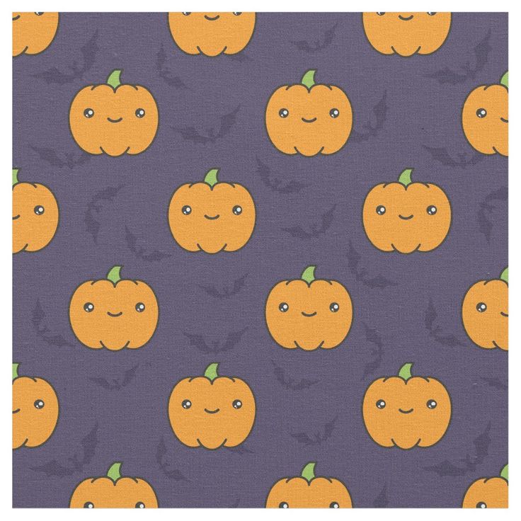 an orange pumpkin pattern on purple fabric