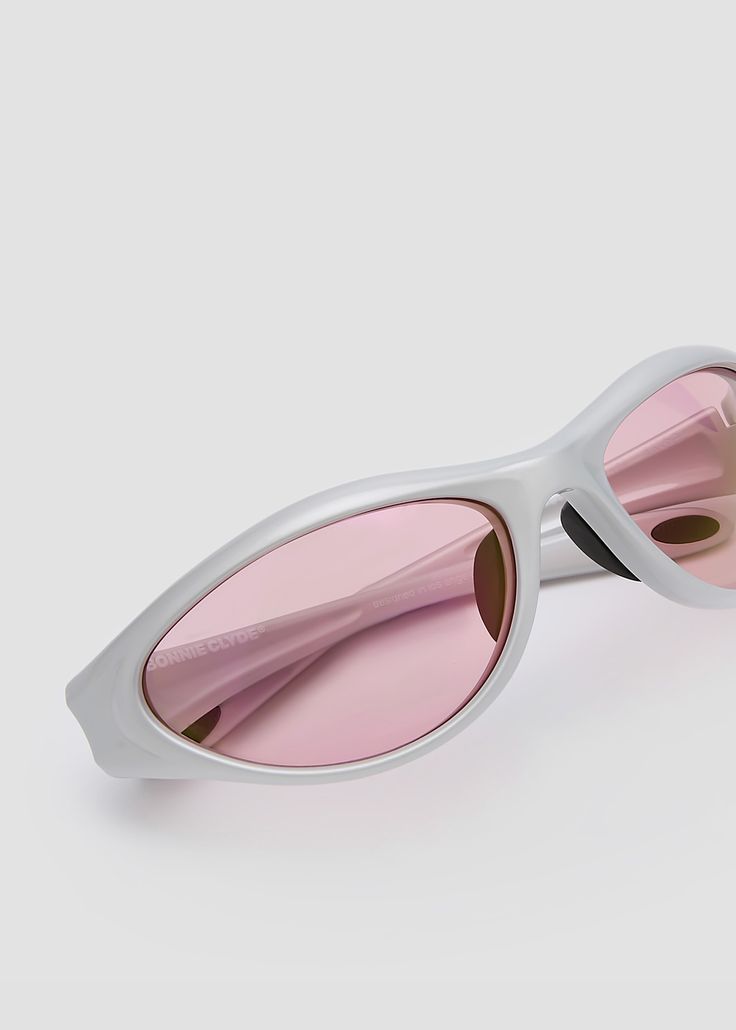 Lightweight, sleek and softly curved wraparound design for both sports and non-sport activities. Features anti-slip rubber nose pads and ear tipsSilver frames with pink lenses. Pink Lenses, Sport Activities, Bonnie Clyde, Silver Frames, Oval Faces, Eyewear Design, Sports Activities, Face Shapes, Sale Items