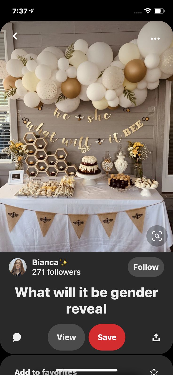 a table topped with lots of white and gold balloons next to a sign that says, what will it be gender reveal?