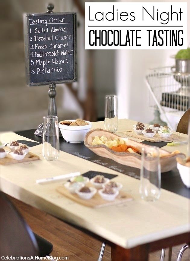 the table is set with plates and bowls of food, along with a sign that says ladies'night chocolate tasting