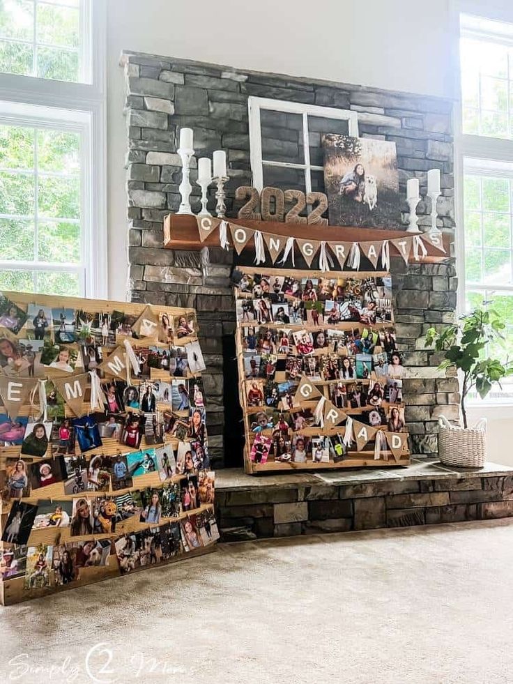 two display boards with pictures on them in front of a brick wall and windows above