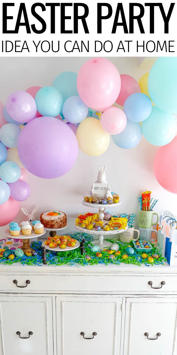 an easter party with balloons, cake and desserts on a buffet table in front of a white dresser