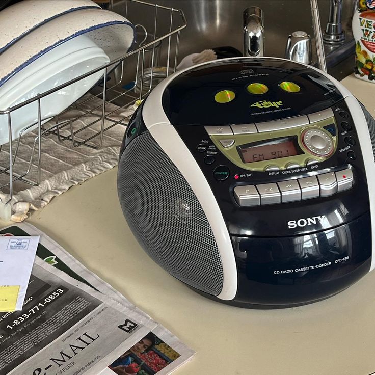 a radio sitting on top of a kitchen counter