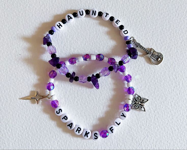 two bracelets with charms on them that say,'baltimore pride'and'baltimore fly '