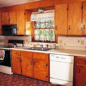 a kitchen with wooden cabinets and white appliances