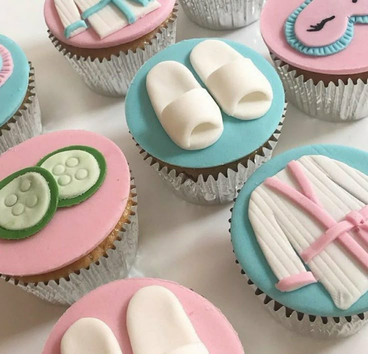 cupcakes decorated with baby shoes and booties