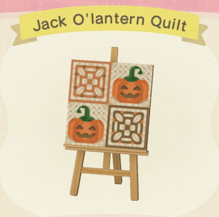 jack o'lantern quilt on an easel with pumpkins