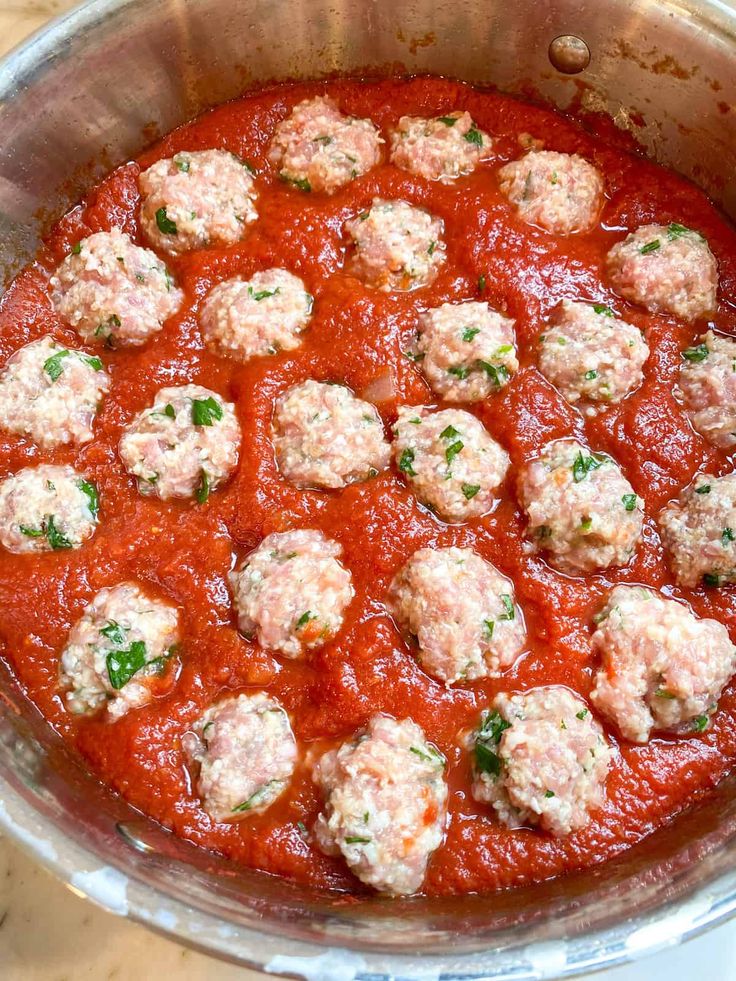 the meatballs are covered in marinara sauce