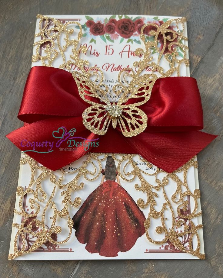 a red and gold card with a butterfly on it