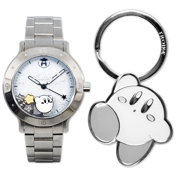 a watch and keychain with a cartoon character on the dial, both in stainless steel