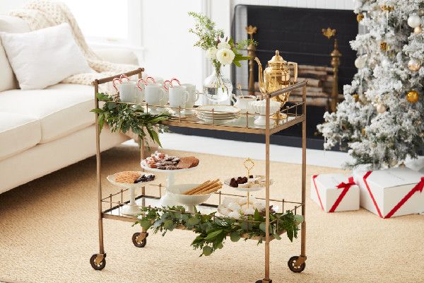 a living room filled with furniture and a christmas tree