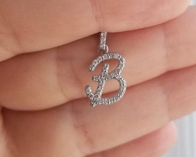 "14K SOLID WHITE GOLD INITIAL PENDANT - NECKLACE WITH DIAMONDS Metal : 14K Solid Gold Necklace Length : 16 inches / 40cm Letter Height : 19.75mm Letter Width : 10.50mm Letter Thickness : 1.9mm Diamond : 36 Diamonds --- Nice White Color Sparkle Diamonds ---- G-H color SI2 clarity Total Carat: 0.36 Carat (Depending on the letter) ---MADE IN USA--- ---All letters from A to Z are available. Please indicate your letter choice in the \"notes to seller\" section on the order. ---This is a beautiful 14K Diamond Initial Pendant Jewelry With Single Diamond, Letter Necklace Initials Diamond, Diamond Initial Pendant With Diamond Cut, Yellow Gold Initial Pendant With Diamond Accents, Diamond Alphabet Pendant Letters, Gold Initial Pendant, Diamond Initial Necklace, Initial Pendant Necklace, Solid Gold Necklace