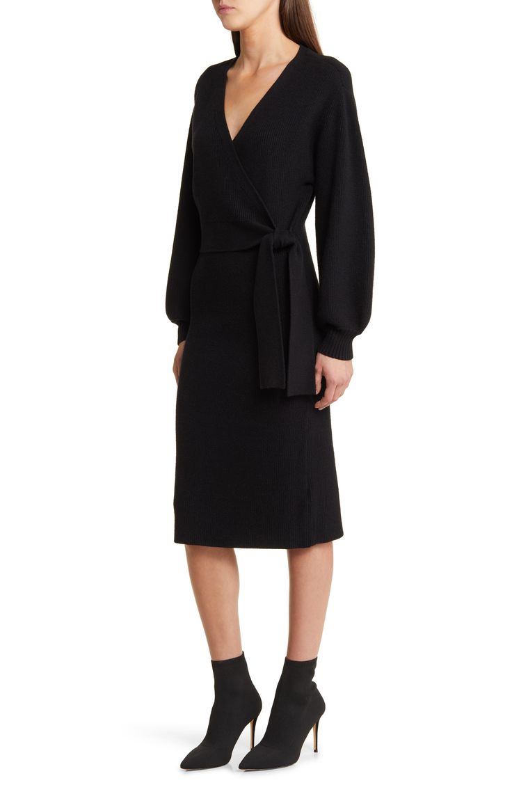 This faux-wrap sweater-dress knit with soft ribbing features a sultry dipped neckline and waist-cinching sash. 40" length (size medium) Surplice V-neck Long sleeves with ribbed cuffs Attached waist tie 50% viscose, 28% polyester, 22% nylon Hand wash, dry flat Imported Long Sleeve Belted Dress For Date Night In Fall, Winter Solid Belted Dresses, Fall Belted Midi Dress For Night Out, Fall Midi Dress With Surplice Neckline For Night Out, Fitted Black Wrap Dress For Fall, Fall Midi Dress With Belt For Night Out, Fall Surplice Neckline Midi Dress For Night Out, Winter Solid Color Belted Dress, Chic Black Wrap Dress For Fall