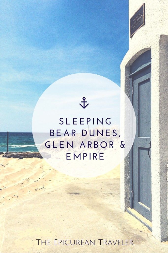 an open door with the words sleeping bear dunes, glenn arbor & empire on it