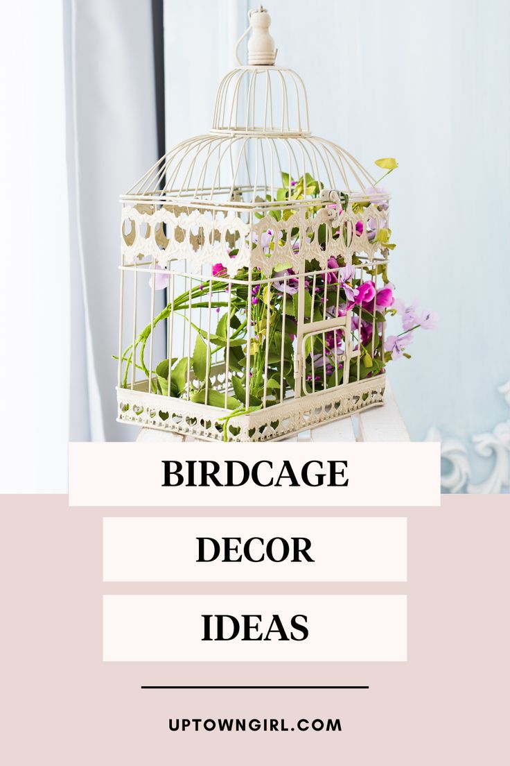 a birdcage filled with flowers sitting on top of a table