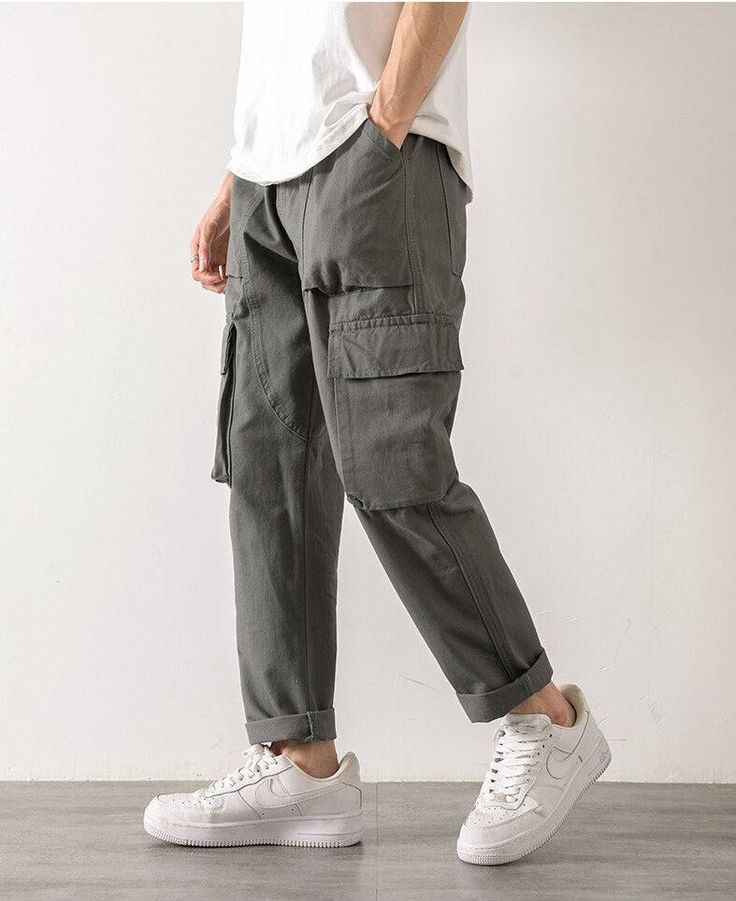 Step out in style with these straight leg cargo pants. Designed with an elasticated waistband and a functional drawstring, these pants are crafted from durable cotton. The cargo-style pockets on the leg add a touch of utilitarian chic, making them a versatile addition to any man's wardrobe. Elasticated waistband with drawstring Men's pants Cotton Cargo-style pockets on leg Straight leg Straight Leg Cargo Pants, Cargo Pants Streetwear, 90s Fashion Grunge, Oversized Streetwear, Streetwear Grunge, Corsets And Bustiers, Pants Cotton, Aesthetic Look, Pantalon Cargo