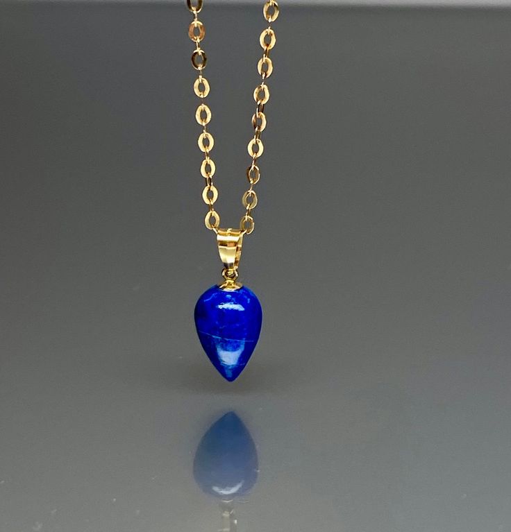 Royal blue Lapis lazuli charm pendant necklace. The lapis charm has a gorgeous deep blue color. The pendant is strung on a 14K goldfilled chain. The lapis lazuli charm pendant is polished and lightweight. The pendant is strung on a 14K goldfilled chain. It is perfect for layering or looks great when worn alone. *Lapis teardrop beads measure: 8X12 mm *Metal:14K gold-filled Earrings drop length : 45 cm /18 inch solid gold, silver, and gemstones are also my materials of choice, I love working with Green Amethyst Jewelry, Jewelry Layering Necklace, Blue Turquoise Necklace, Green Amethyst Earrings, Jewelry Layering, January Birthstone Jewelry, Geometric Pendant Necklace, Turquoise Statement Necklace, Lapis Pendant