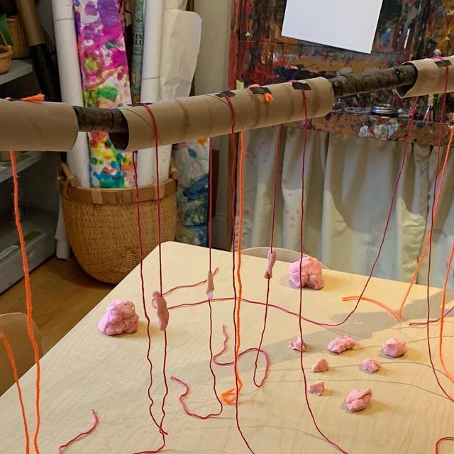 an art project with yarn and cotton balls