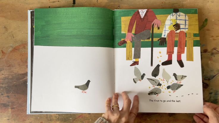 an open children's book with illustrations of two people sitting on a bench and birds flying around