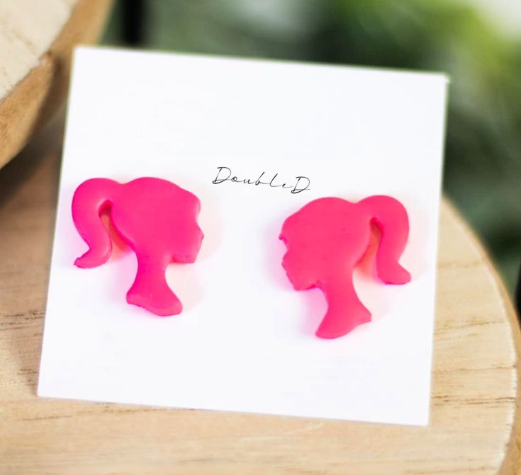 Let the world know you're totally pink barbie-fied! These hot-pink barbie-shaped clay earrings showcase your style with sass, and make an unforgettable statement. For truly fabulous, totally retro vibes, accessorize your look with these unique clay earrings! #TotallyBarbiefied Barbie Earrings Clay, Polymer Clay Barbie Earrings, Barbie Polymer Clay, Fun Pink Polymer Clay Earrings, Handmade Pink Plastic Earrings, Playful Pink Plastic Earrings, Trendy Pink Plastic Earrings, Barbie Clay Earrings, Unique Clay Earrings