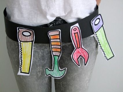 a person wearing a black belt with different colored objects on the waist and bottom of their pants